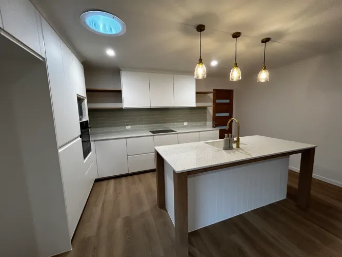 Kitchen reno showing the island with built in sink